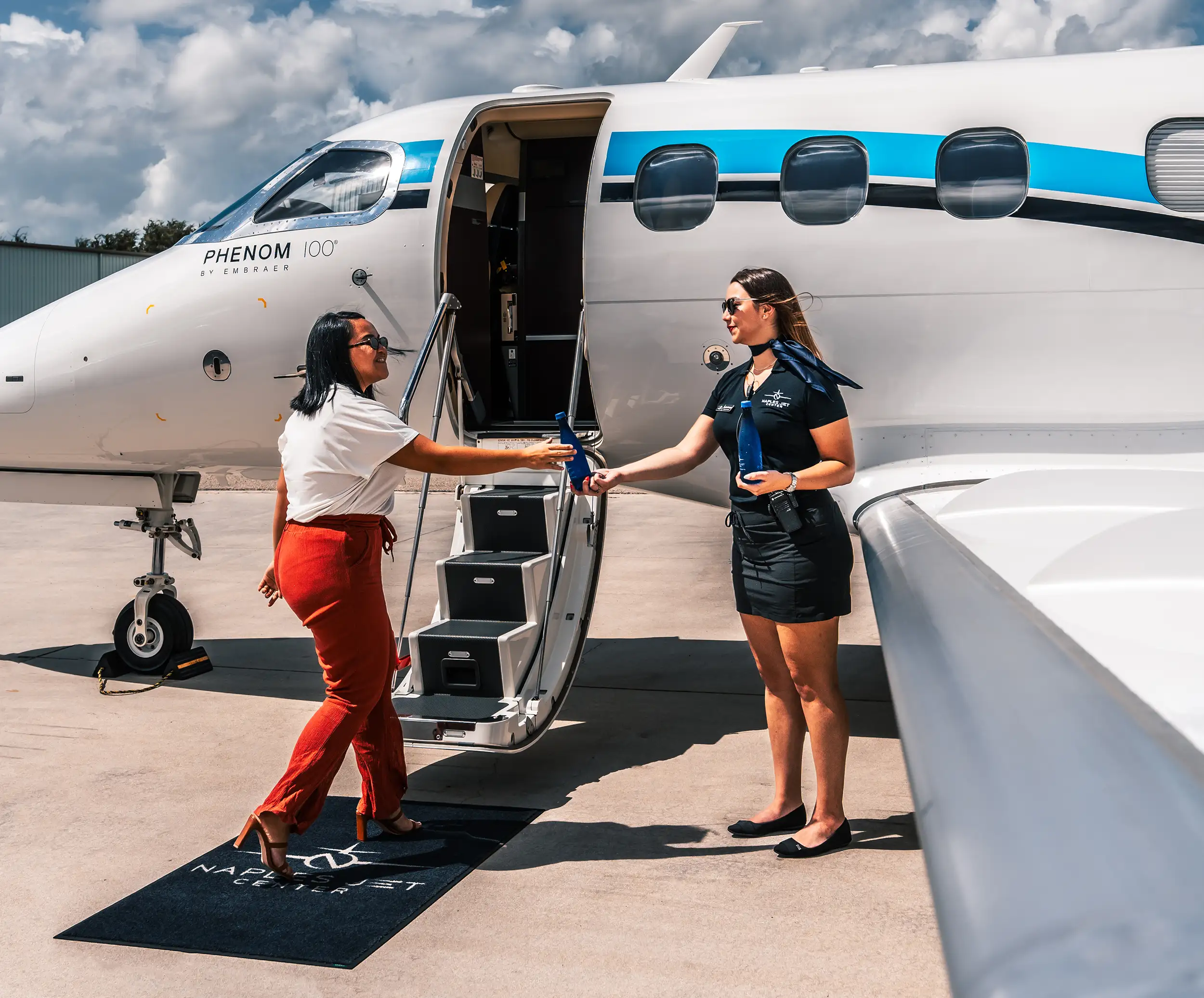 Women at Private Airport, Naples FL, getting on plane